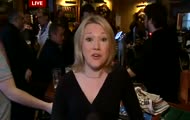 Man Makes Funny Faces Behind Reporter